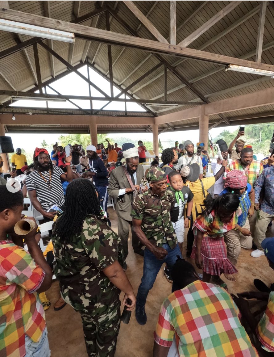 cockpit country, flagstaff, interpretive centre, interpretive center, community center, open-air structure, timber construction, truss, event, people, entertainment, community, dance, music, culture, Jamaican culture