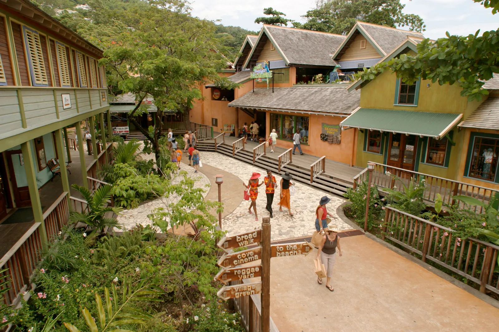 CHUKKA Island Village Outpost entrance under a bamboo canopy, bright sign and tropical planting at the forecourt.